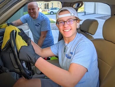 Shiny Mobile Auto Detail crew cleaning a vehicle at the customer's location