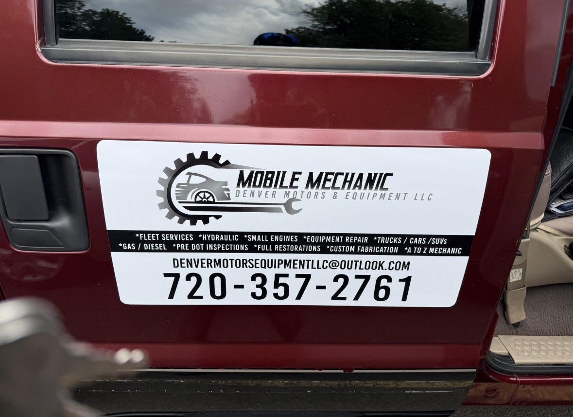 Denver Motors truck door logo and contact reference
