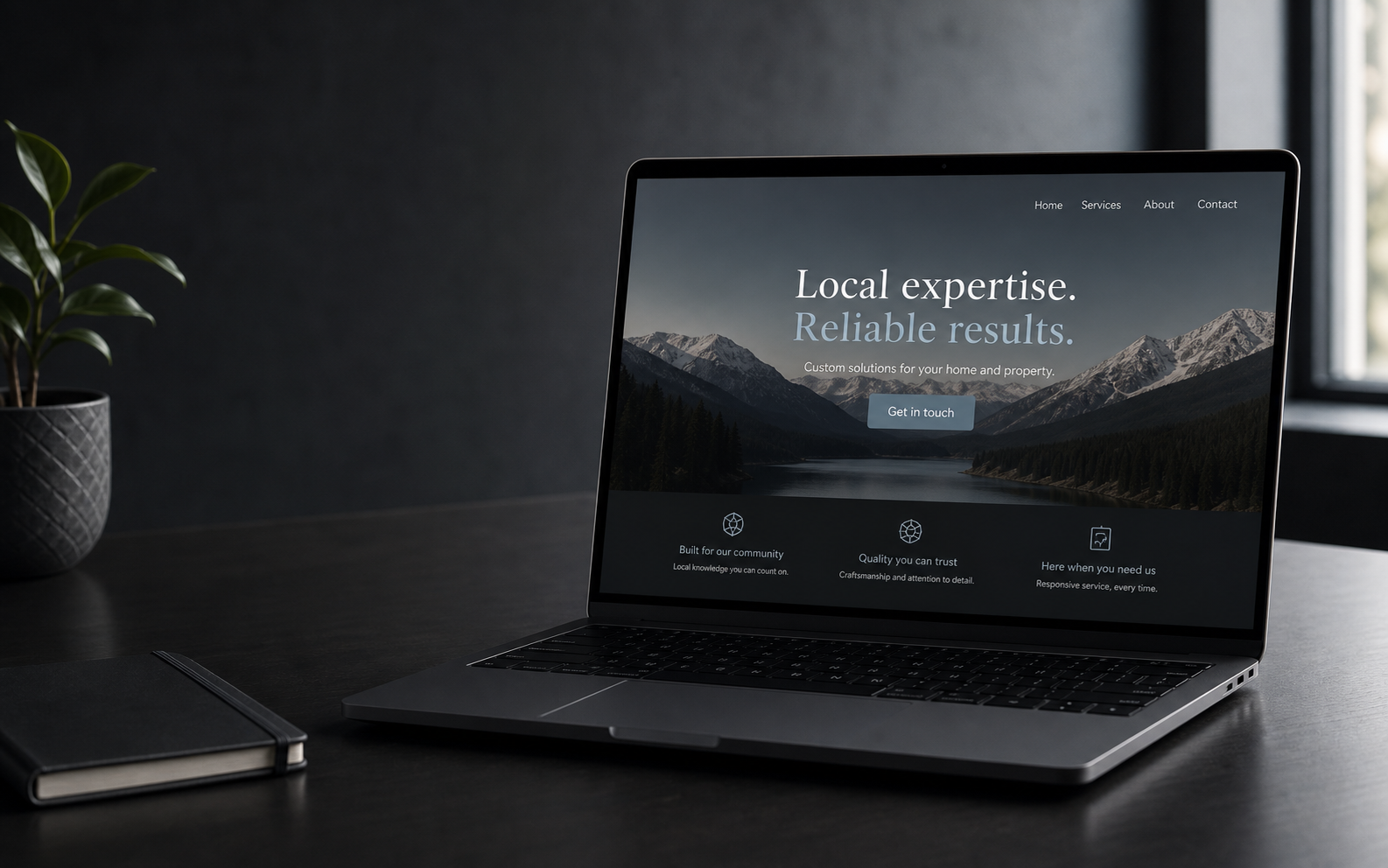A custom local-business website displayed on a laptop in a refined studio
