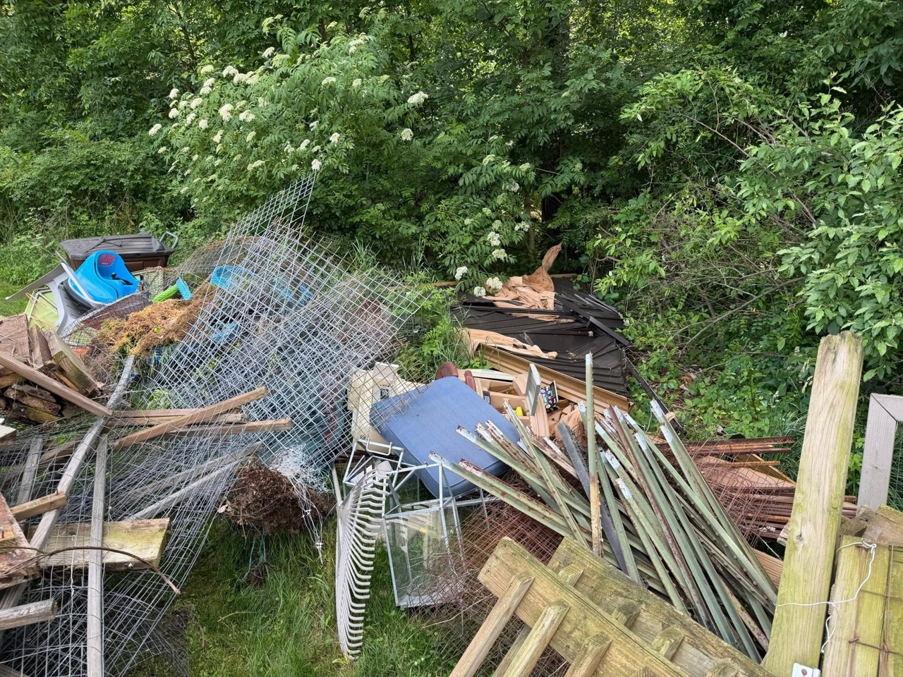 Close view of mixed yard debris and junk pile